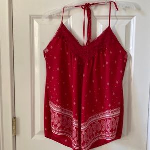 Red Halter top with handkerchief bottom. Appliqué pattern at neck. Medium